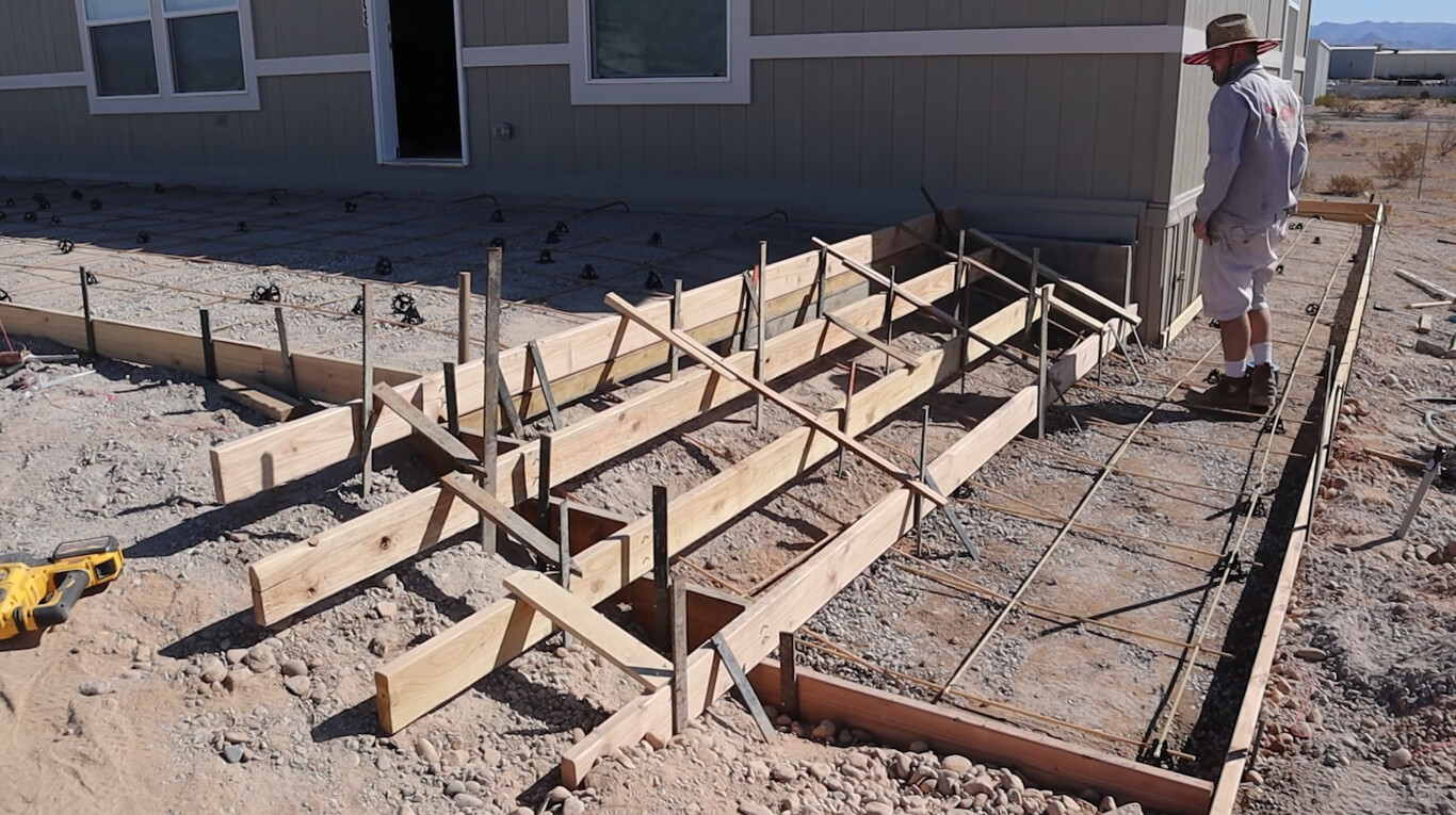 Concrete foundation preparation for driveway in Delano, CA
